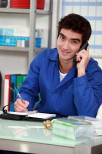 a Santa Clare Plumber takes a call from a client