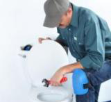 Plumber in Santa Clara CA prepares to install a toilet